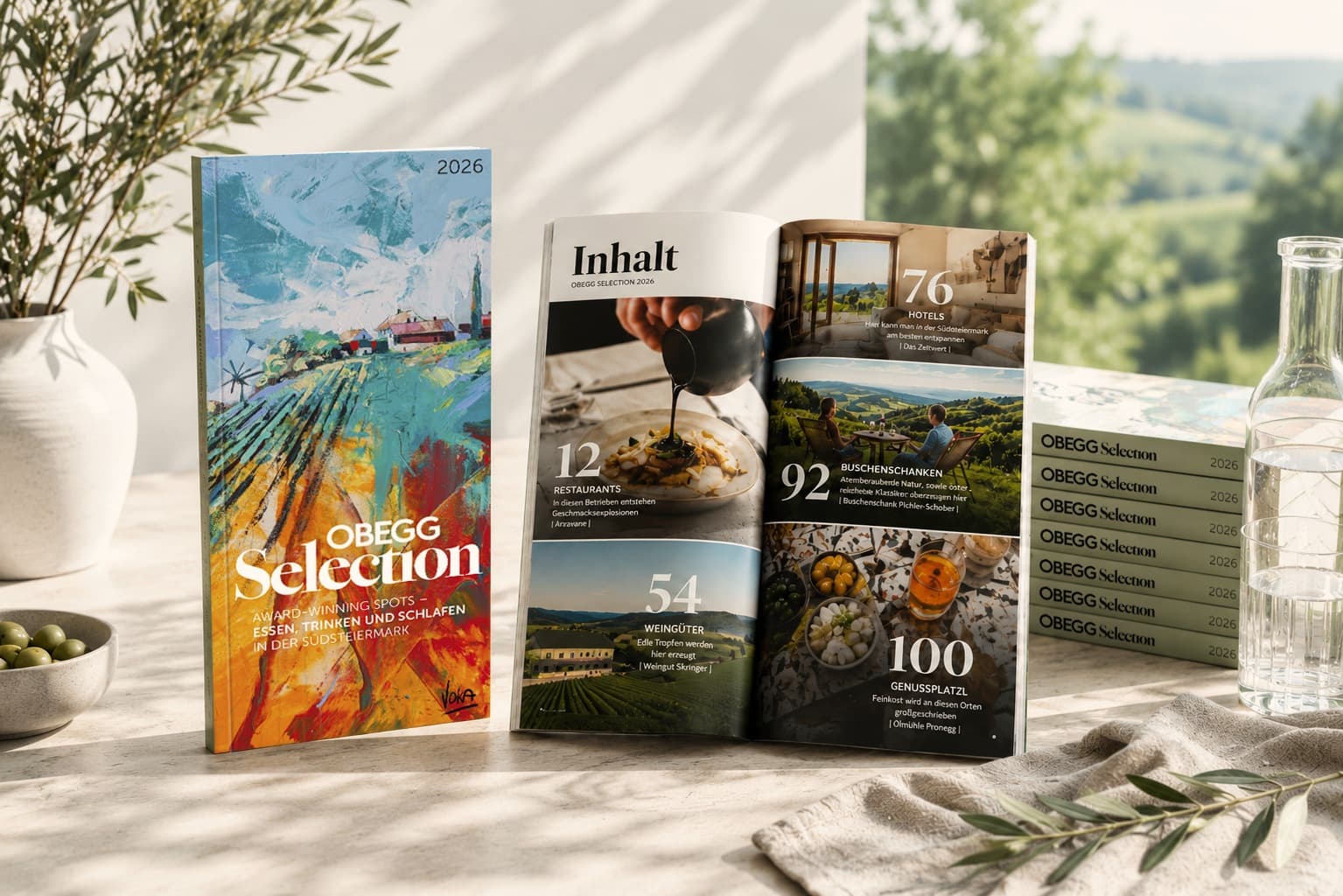 OBEGG Selection Guide 2026 mit Gemälde-Cover und aufgeschlagenem Inhaltsverzeichnis zu Restaurants, Hotels und Weingütern